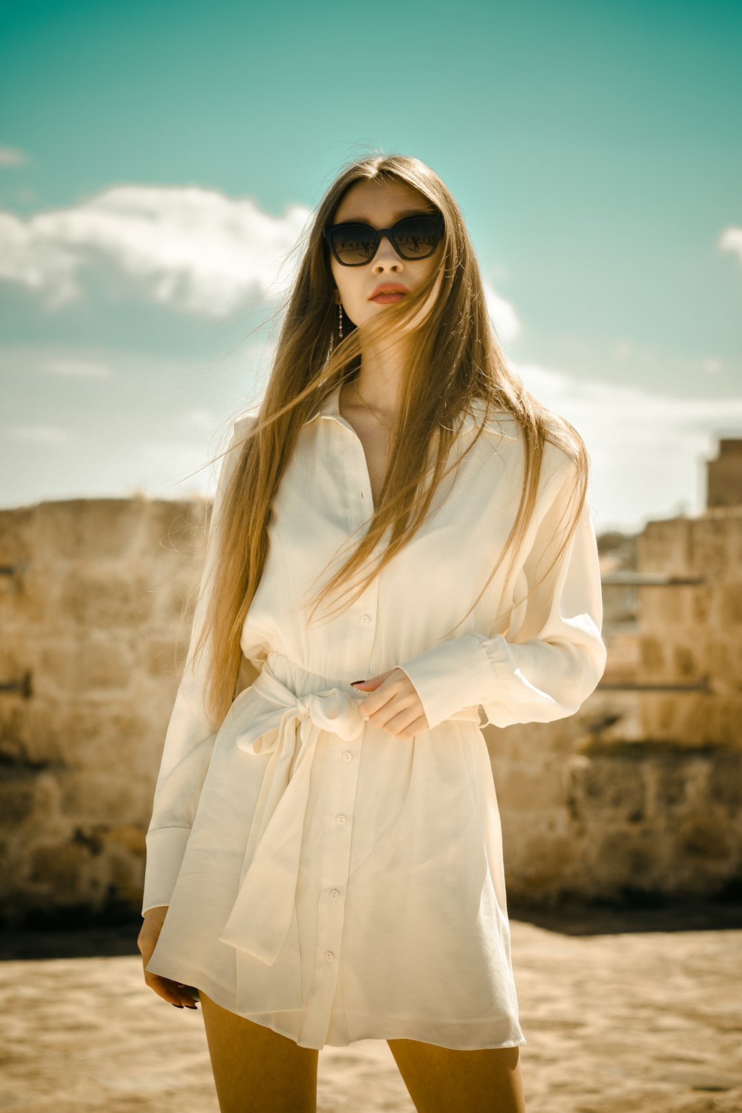 woman-in-white-long-sleeve-dress-wearing-black-sunglasses-y6hmz1pjc0